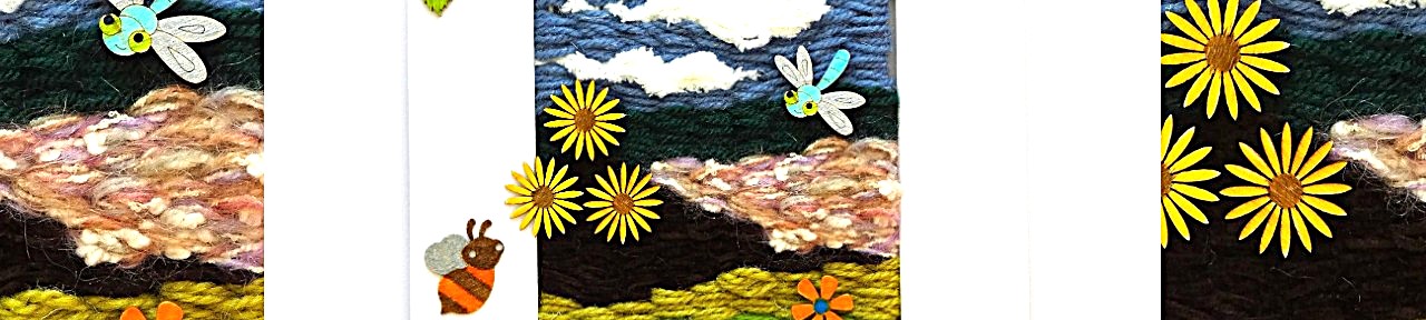 Example of a children’s mixed media weaving project featuring a hand-woven landscape with clouds, flowers, and wooden mini-beasts.