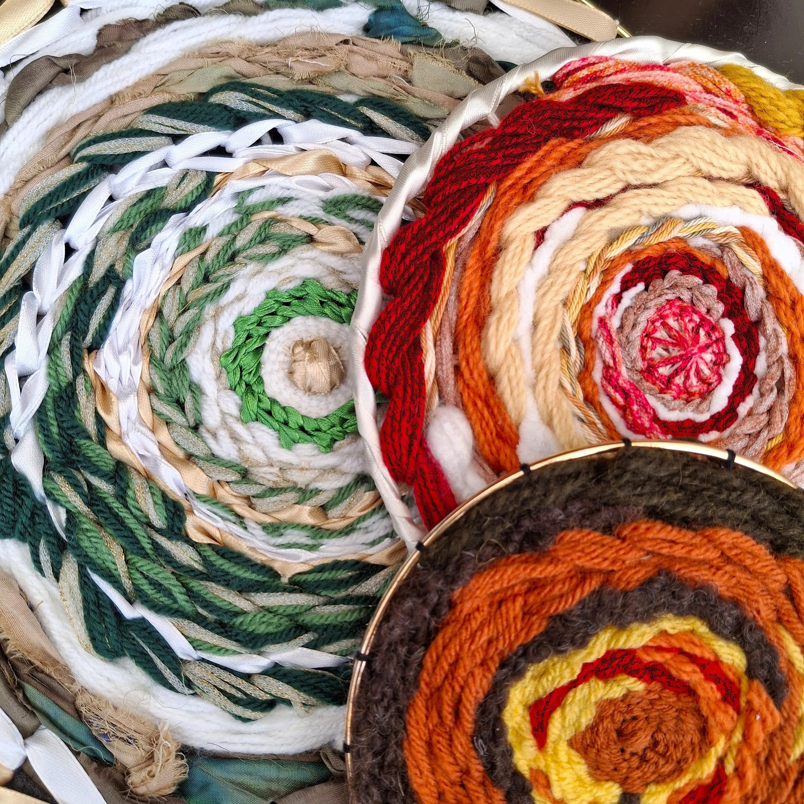 Sustainable circular weaving workshop example: woven hoops made from recycled and surplus materials in a seasonal colour palette.