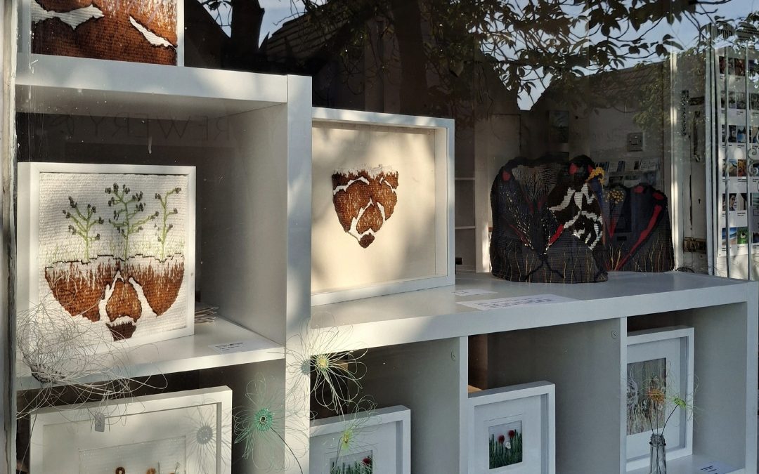 Lucy Sugden's woven textile artwork on display in the Wynd Gallery window